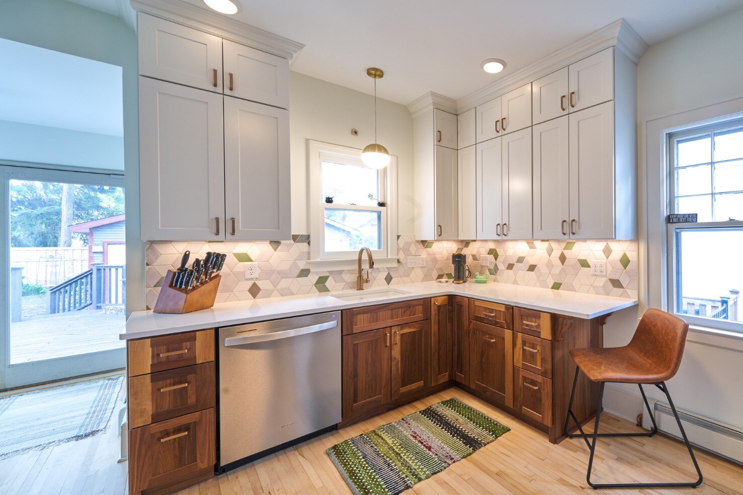 Remodeled kitchen with abstract tile backsplash by Hanson Remodeling