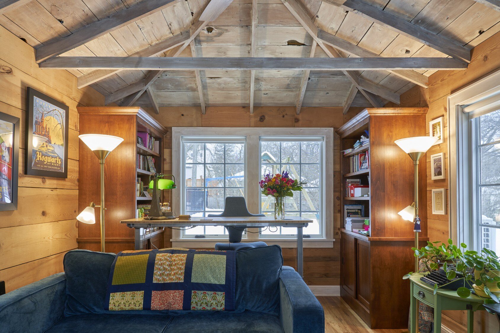 Remodeled garage space transformed into an office with large windows by Hanson Remodeling