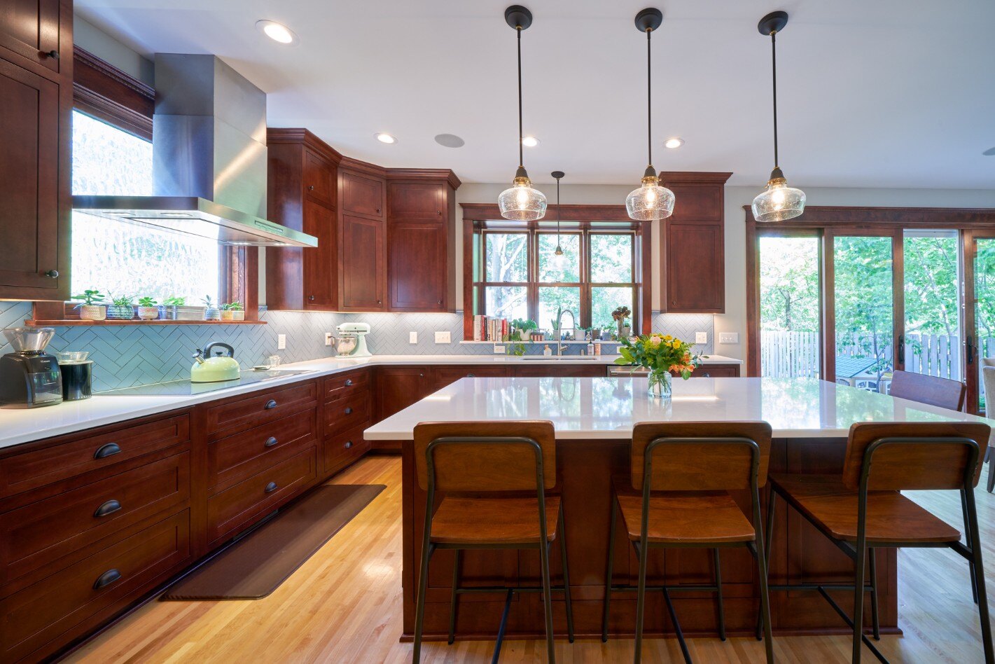 Remodeled kitchen with dark wood cabinetry by Hanson Remodeling